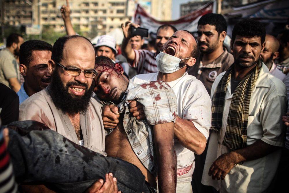 Июльские столкновения демонстрантов с сотрудниками службы безопасности в Каире. Фото: Mosa'ab Elshamy, Anadolu Agency